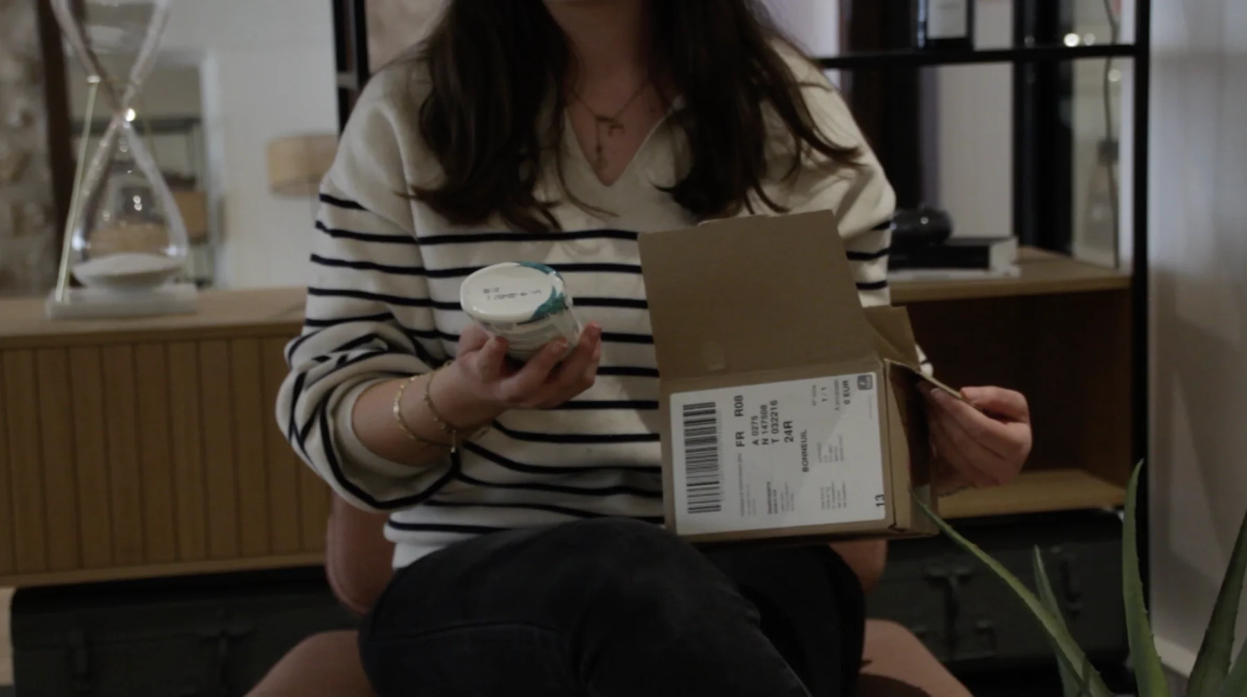 A consumer unboxing a product sample received for testing