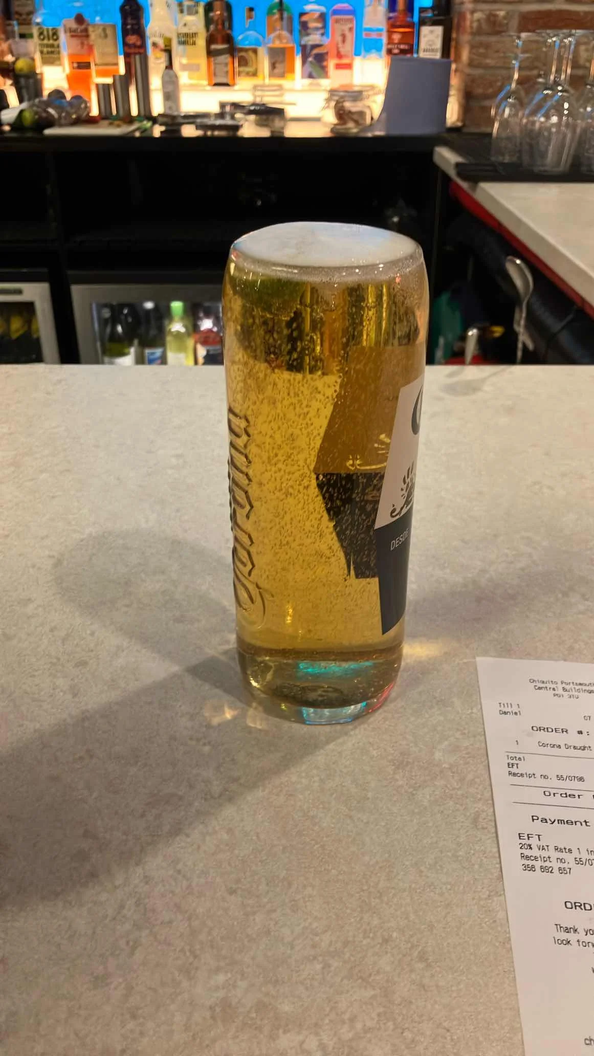 Beer served in a non-branded glass with no lime garnish visible
